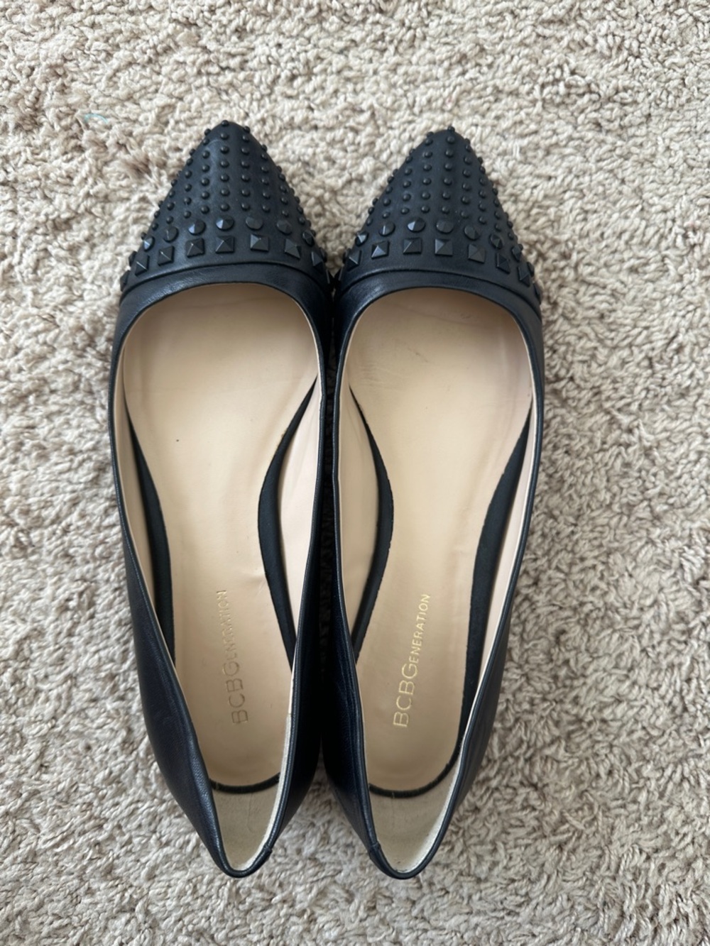 BCBGeneration Black Pointed Studded Leather-Look Flats. They run big,fits 8.5.